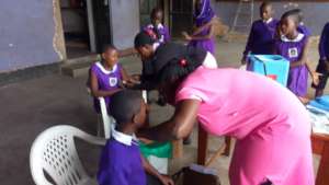 Nyaka students receiving Measles immunization
