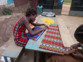 Josephine, a U16 Superstar sews her equipment bag
