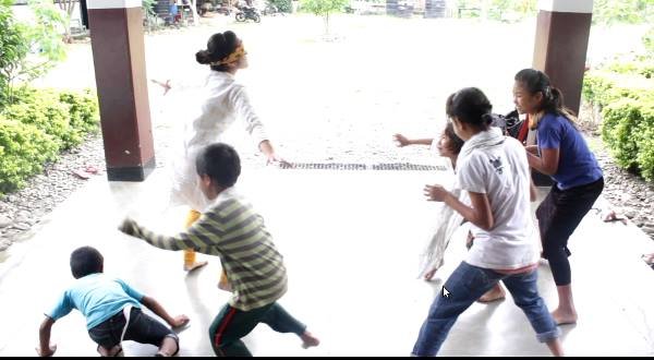 Kids playing with one of the team members