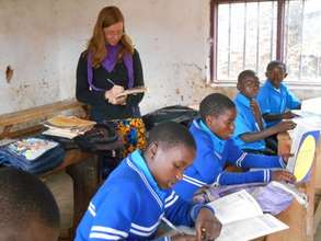 A German volunteer teaching the OVCs