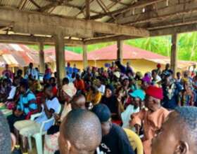 Villagers learning about the rights of children