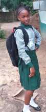Sierra Leonean girl in her new school uniform.