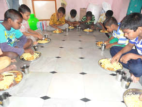 abandoned orphan children enjoying with breakfast