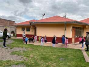 Ruth & teachers quiz little ones on 2022rules 2X