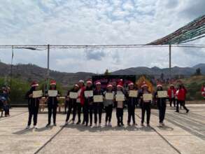 CW graduates line up with diplomas