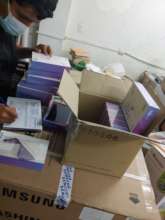 Dr Jorge sorting award tablets for students