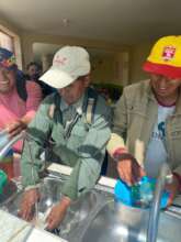 Father happily wash dishes - happy about crop
