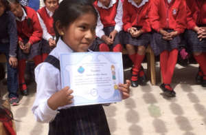 Proud girls is promoted to next grade with diploma