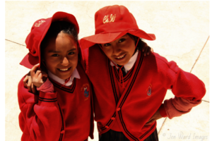 Big floppy sun hats protect girls from heat
