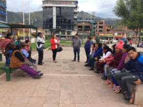 Teachers meet with parent near their homes in park