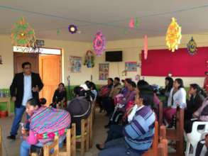 Edgard tells parents the how-to for a small bus.