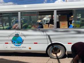 loading up the bus-food for 97 families
