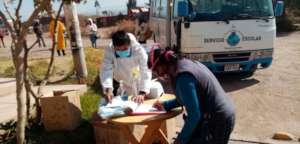 Parents line up for food distribution and logging