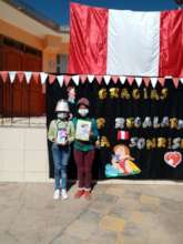 Mother stands with daughter receive tablet award