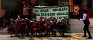 Teacher leads the little ones in Xmas song