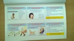 Parents learn CPR from MEDRIX handout