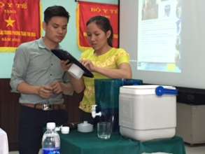 Leaders learn how to use the LifeStraw system