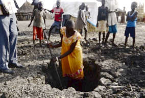 Process of digging a latrine pit