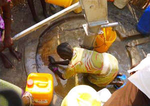 A woman using a borehole (Longechuk County)