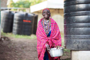 A local Indigenous woman collecting water.