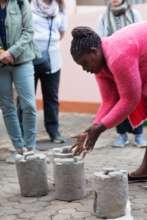 Naiyan finishing a jiko stove.