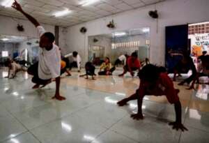 French volunteer, Amaury Mayaya teaching dance