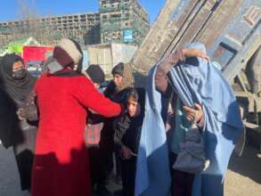 Beneficiaries gathering to receive the coal bags