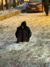 Waiting for a donation on the cold street