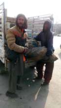 Men receiving sacks of coal
