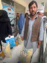 Rasool receiving food pacckage