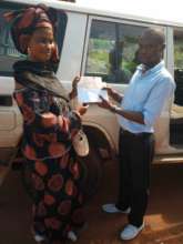 Umu's mother receives Hardship Fund donation
