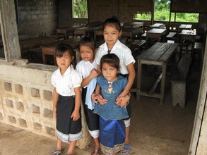 Students in front of a classroom before renovations