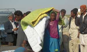 Quilts provided to poor women near Jati