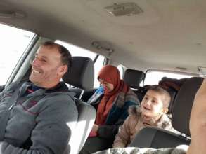 A patient and her family traveling to the hospital