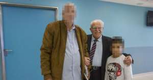 A holocaust-survivor volunteer and a child patient