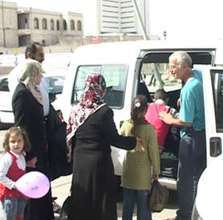 Patients stepping into a volunteer's car
