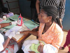 A mother and child getting screening for anemia