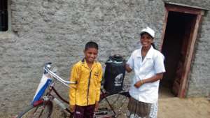 Nita on her bicycle with the nitrogen container