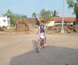 Aarti with her bicycle