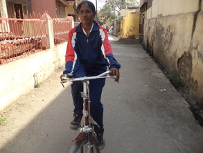 Farida rides on her bike