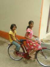 Snehal with her bicycle
