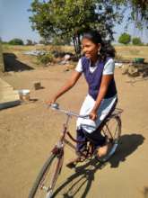 Megha with her bicycle