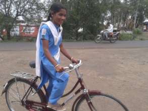 Pratiksha with her bicycle