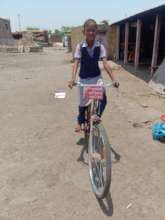 Rupali with her bicycle