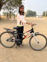 Swarali with her new bicycle