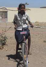 Nakusa riding on bicycle