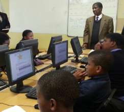 Principal addressing learners at Mzamomhle Primary