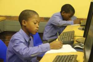 Learner completing his assessment