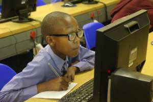 Learner completing his assessment