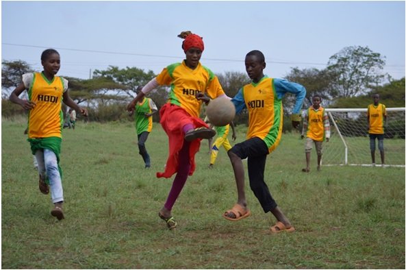 Girls playing football